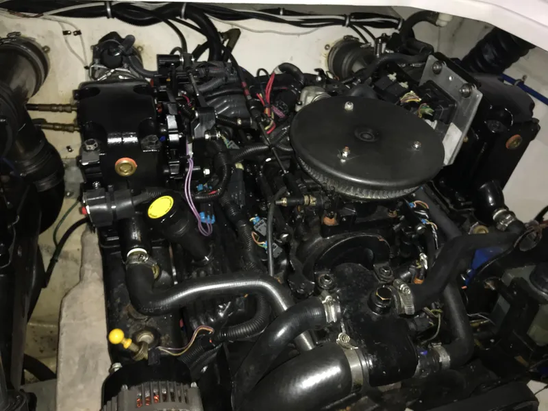 Slide: The Image of Engine of a 2007 Donzi 28 ZX Open boat, showcasing intricate mechanical components. - 31