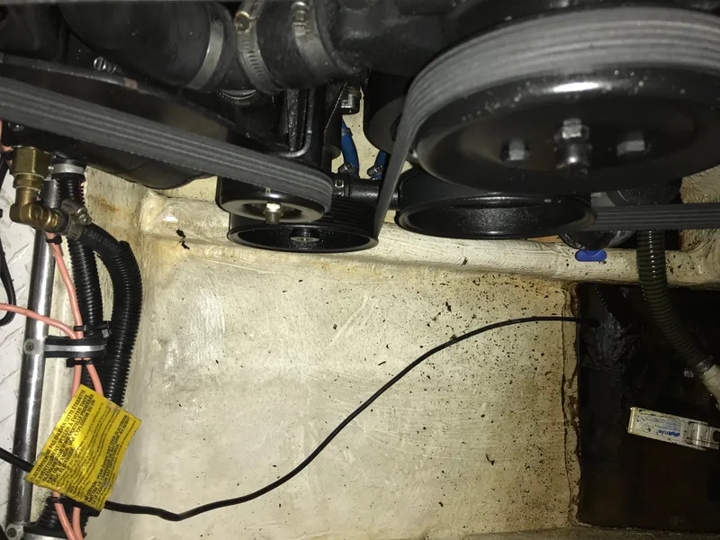 Slide: The Image of Engine compartment of a 2007 Donzi 28 ZX Open boat, showing belts and wiring. - 32