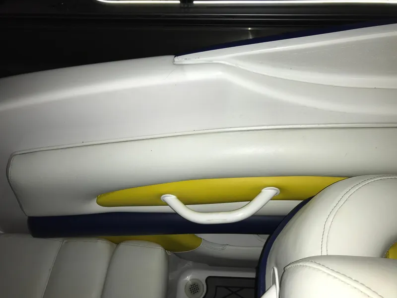 Slide: The Image of Interior of 2007 Donzi 28 ZX Open boat with white and yellow seating. - 33