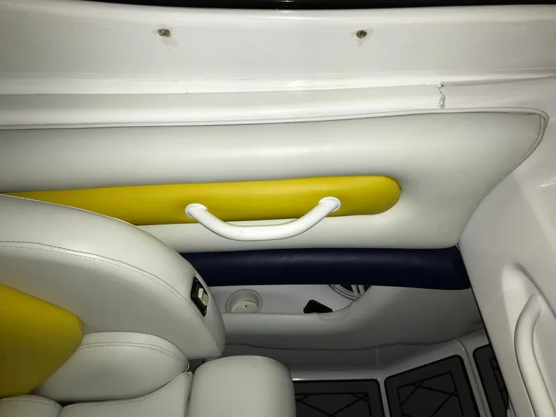 Slide: The Image of Interior of a 2007 Donzi 28 ZX Open boat with white and yellow upholstery. - 34
