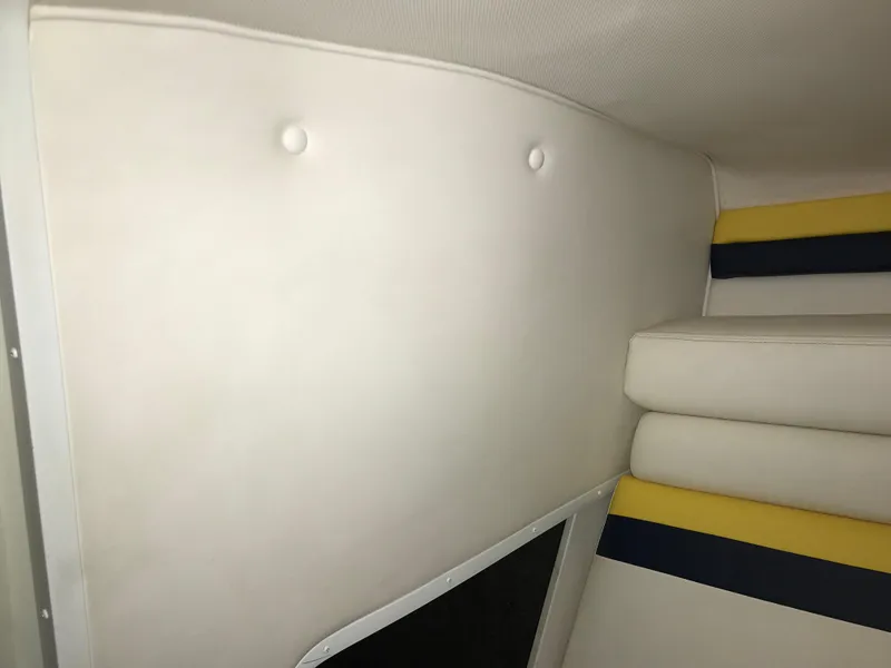 Slide: The Image of Interior of 2007 Donzi 28 ZX Open boat with white and striped upholstery. - 44