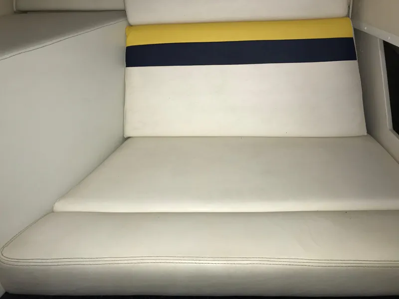 Slide: The Image of 2007 Donzi 28 ZX Open boat interior with white, yellow, and blue seating. - 46