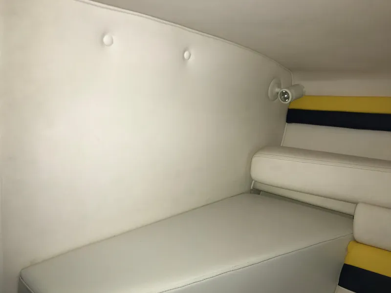 Slide: The Image of Interior of 2007 Donzi 28 ZX Open boat with white and yellow seating. - 48