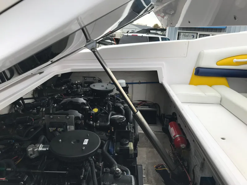 Slide: The Image of Engine compartment of a 2007 Donzi 28 ZX Open boat, showcasing mechanical components. - 9