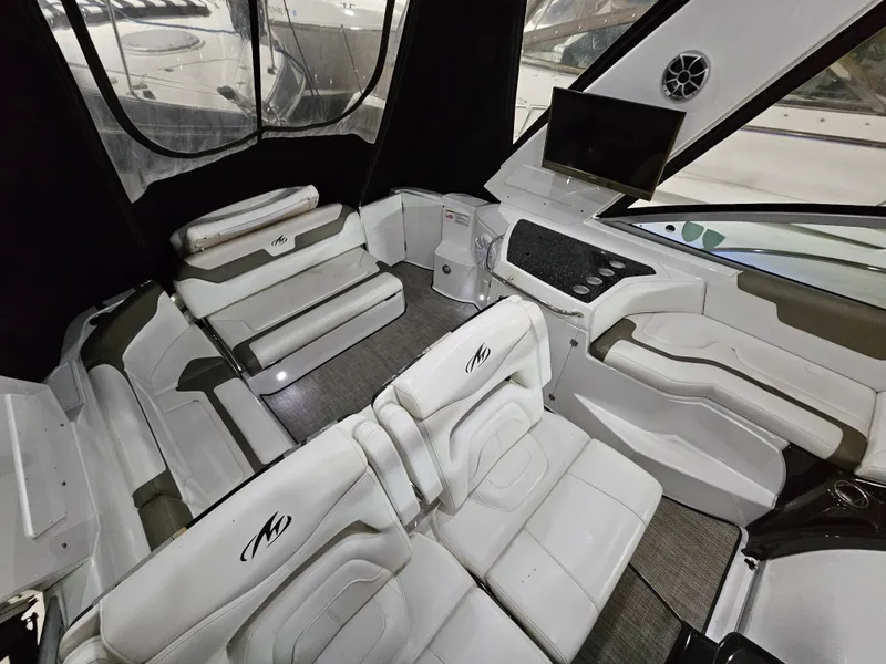 Slide: The Image of Cockpit of 2016 Monterey 355 Sport Yacht with modern controls and steering wheel. - 2