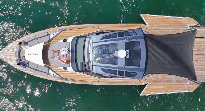Slide: The Image of Aerial view of 2023 OKEAN 57 yacht on water, featuring sleek design and spacious deck. - 2