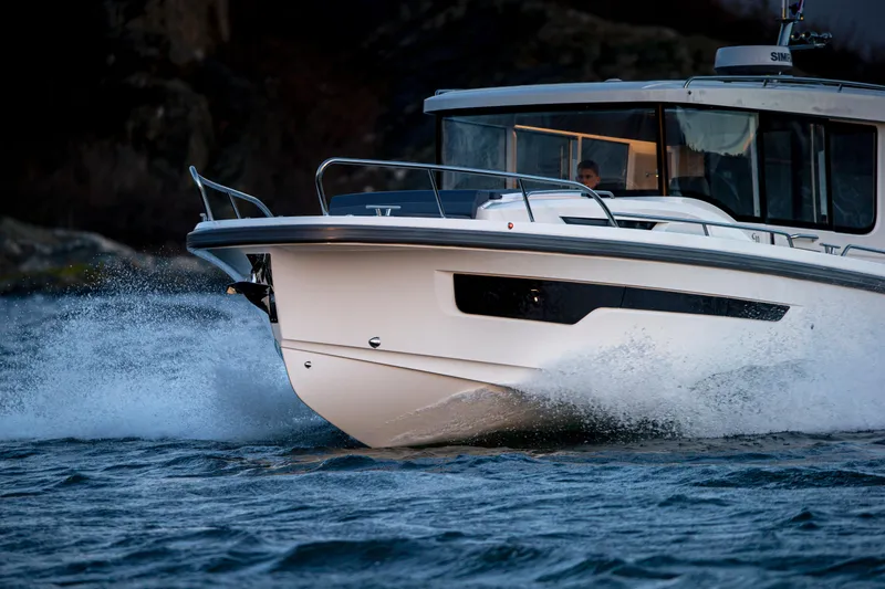 Slide: The Image of Nimbus C11 2025 boat cruising on water, showcasing sleek design and performance. - 16