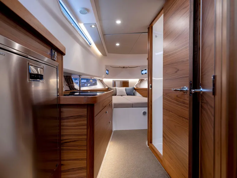 Slide: The Image of Luxurious interior of 2025 Nimbus C11 yacht with wood finishes and modern amenities. - 18