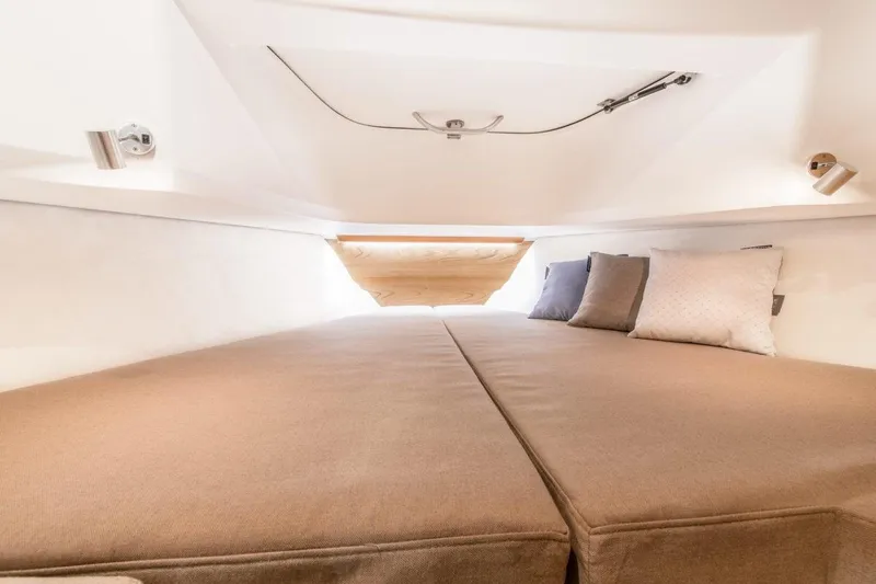 Slide: The Image of Luxurious interior cabin of 2025 Nimbus C9 boat with cozy bedding. - 15