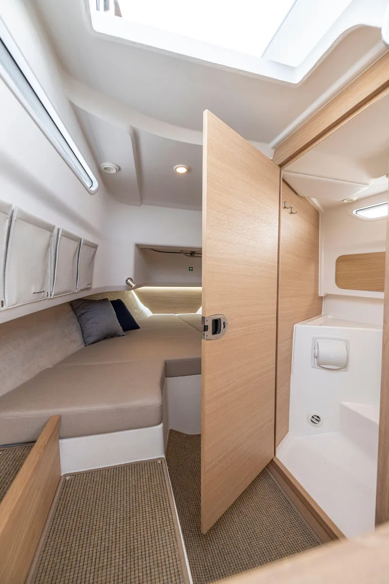 Slide: The Image of Modern Nimbus C9 2025 boat interior with cozy cabin and sleek wooden finishes. - 16