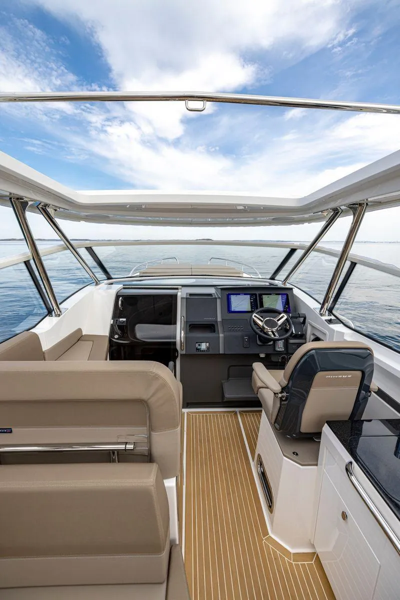 Slide: The Image of Interior of 2025 Nimbus W11 boat with modern helm and seating. - 38