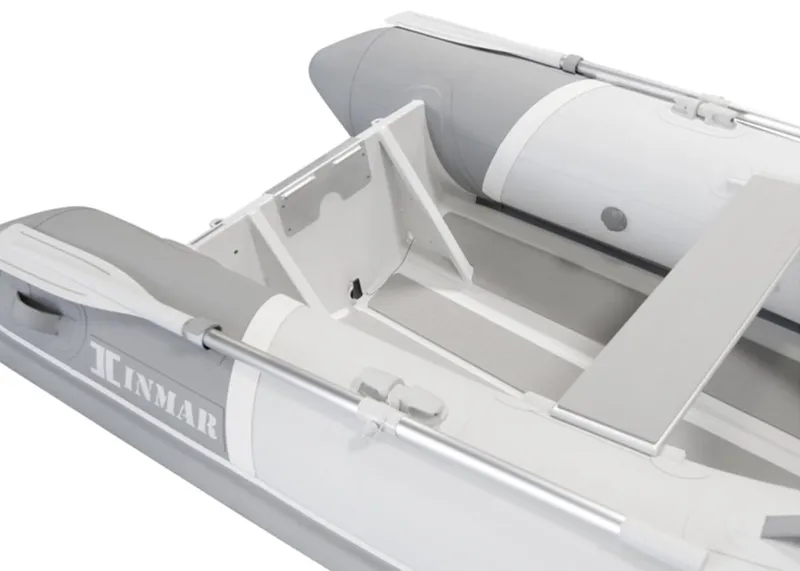 Slide: The Image of 2023 Inmar Aluma Lite 280R inflatable boat, white and gray design, interior view. - 4