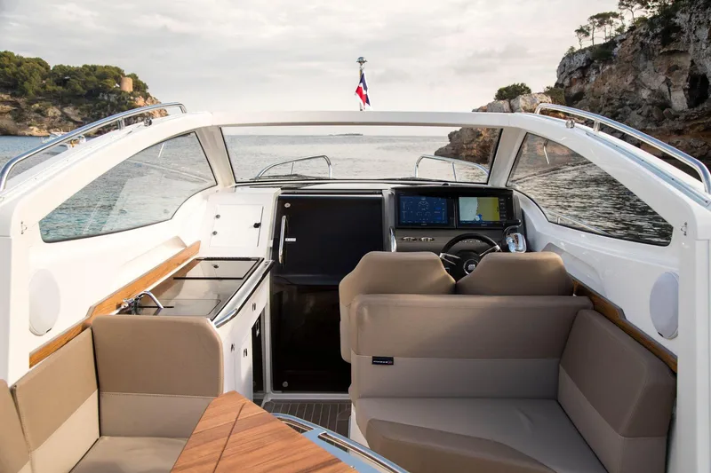 Slide: The Image of Interior of 2025 Nimbus Weekender 9 boat with modern seating and navigation system. - 18