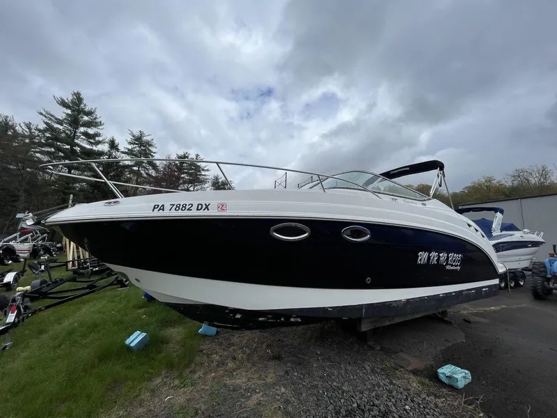 Slide: The Image of 2007 Chaparral 250 Signature boat on land, cloudy sky background. - 1