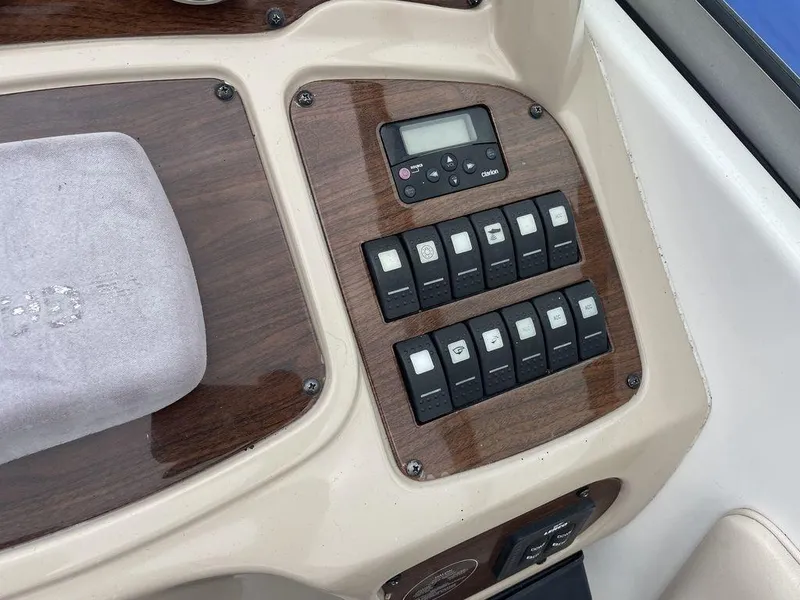 Slide: The Image of Control panel of 2007 Chaparral 250 Signature boat with switches and display. - 11