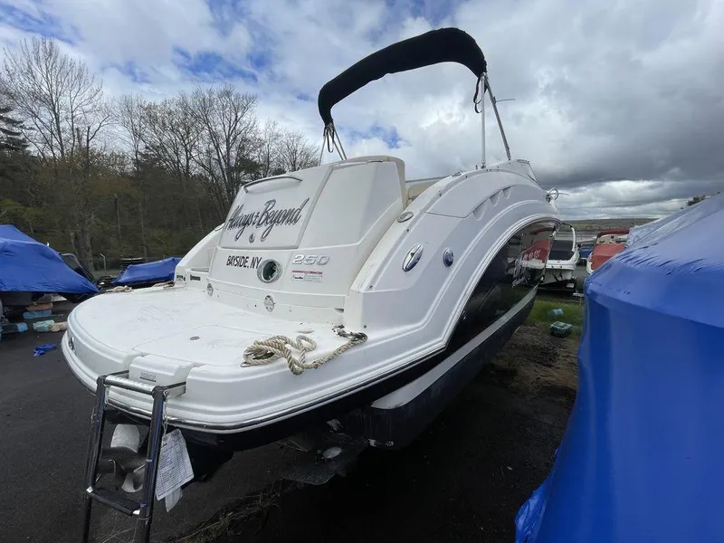 Slide: The Image of 2007 Chaparral 250 Signature boat in outdoor storage, overcast sky. - 14