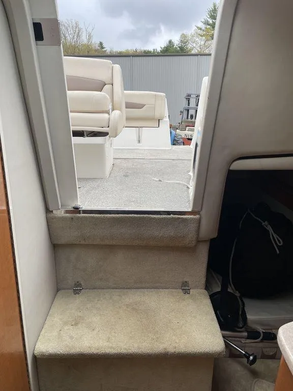 Slide: The Image of Interior view of 2007 Chaparral 250 Signature boat, showing steps to deck seating area. - 15