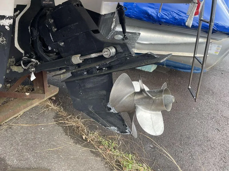 Slide: The Image of 2007 Chaparral 250 Signature boat propeller and stern drive on pavement. - 17