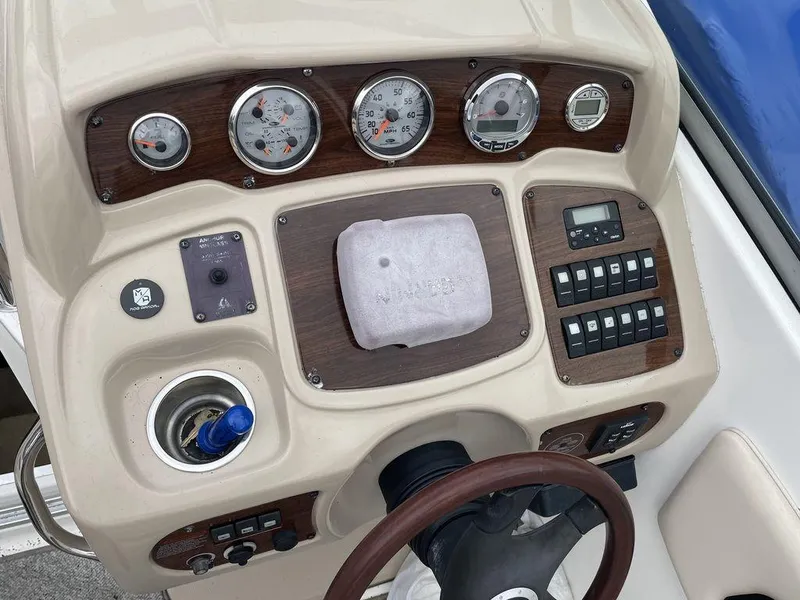 Slide: The Image of 2007 Chaparral 250 Signature boat dashboard with gauges and controls. - 18