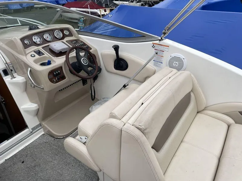 Slide: The Image of 2007 Chaparral 250 Signature boat interior with steering wheel and seating area. - 20
