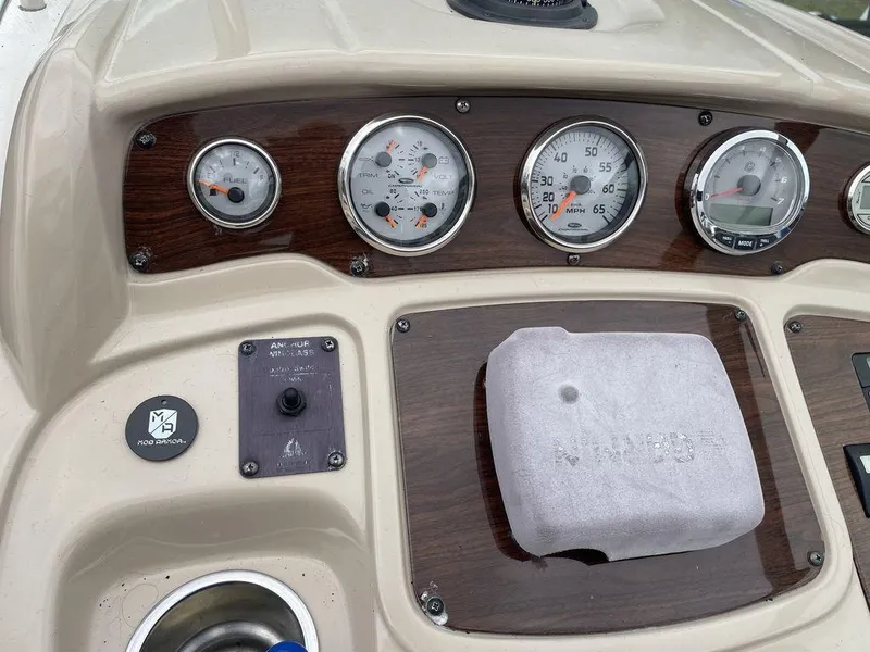 Slide: The Image of Dashboard of a 2007 Chaparral 250 Signature boat with gauges and controls. - 8