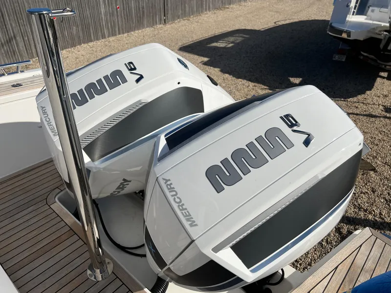 Slide: The Image of Twin Mercury V6 engines on 2024 Nimbus Tender 9 boat deck. - 3