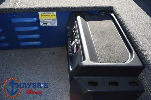 Slide: The Image of 2024 Lund 1650 Angler Tiller boat interior with control panel and Thayer's Marine logo. - 17