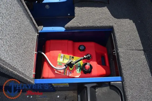 Slide: The Image of 2024 Lund 1650 Angler Tiller fuel compartment with red gas tank. - 18