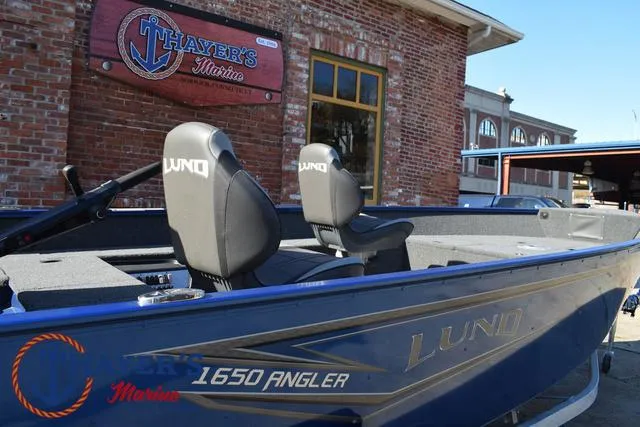 Slide: The Image of 2024 Lund 1650 Angler Tiller boat at Thayer's Marine dealership. - 24