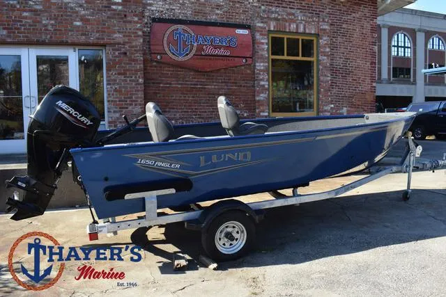 Slide: The Image of 2024 Lund 1650 Angler Tiller boat on trailer at Thayer's Marine. - 27