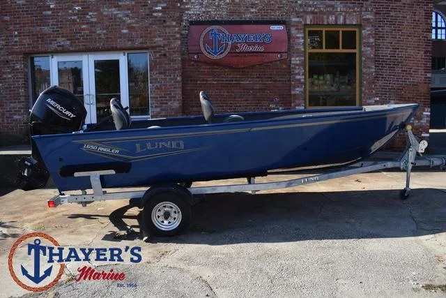 Slide: The Image of 2024 Lund 1650 Angler Tiller boat on trailer at Thayer's Marine. - 28