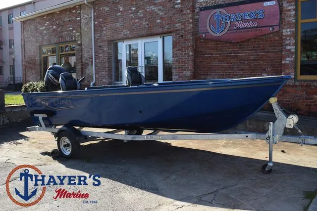 Slide: The Image of 2024 Lund 1650 Angler Tiller boat on trailer at Thayer's Marine dealership. - 29