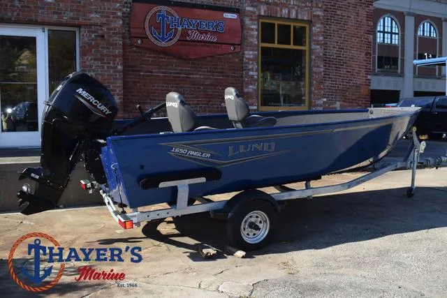 Slide: The Image of 2024 Lund 1650 Angler Tiller boat on trailer at Thayer's Marine. - 3