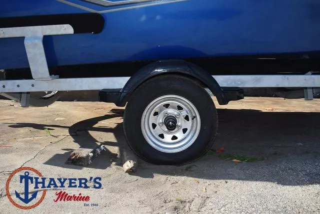 Slide: The Image of 2024 Lund 1650 Angler Tiller boat trailer wheel at Thayer's Marine. - 5