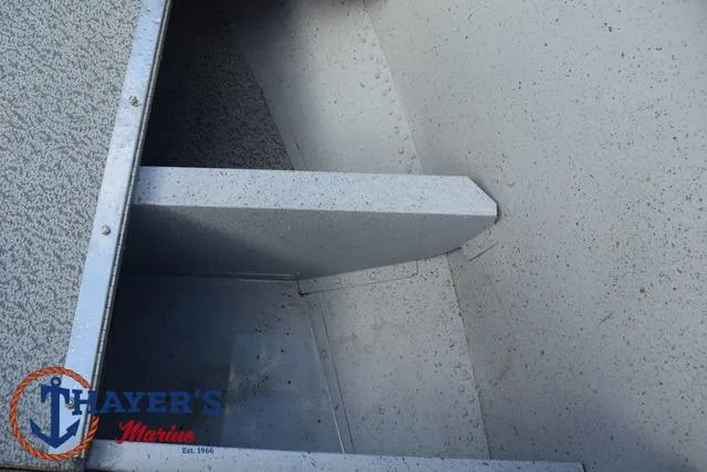 Slide: The Image of 2024 Lund 1600 Fury SS boat interior detail with Thayer's Marine logo. - 13