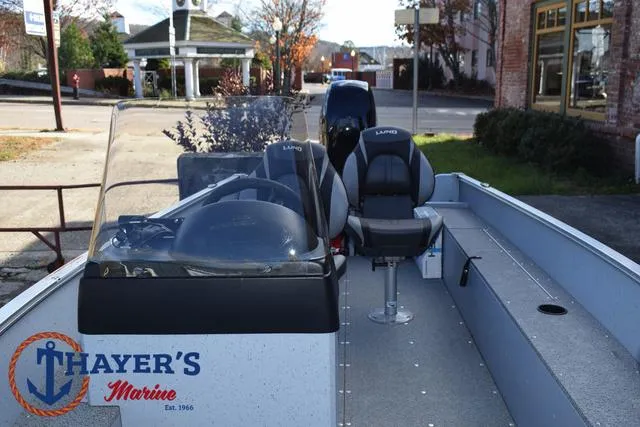 Slide: The Image of 2024 Lund 1600 Fury SS boat interior at Thayer's Marine dealership. - 14