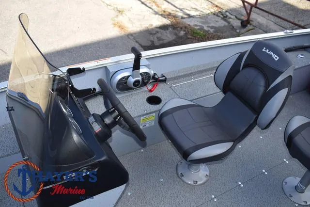 Slide: The Image of 2024 Lund 1600 Fury SS boat interior with steering console and seating. - 15