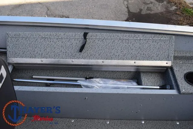 Slide: The Image of 2024 Lund 1600 Fury SS boat storage compartment with fishing rod holder. - 19