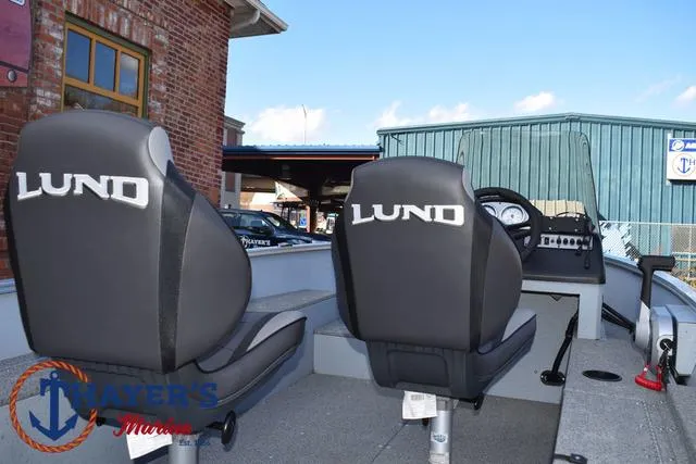 Slide: The Image of 2024 Lund 1600 Fury SS boat interior with branded seats at Mayer's Marina. - 21