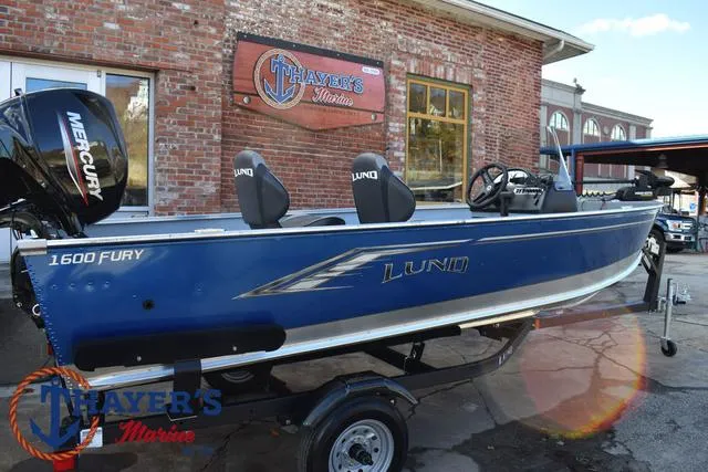 Slide: The Image of 2024 Lund 1600 Fury SS boat displayed at Thayer's Marine dealership. - 28