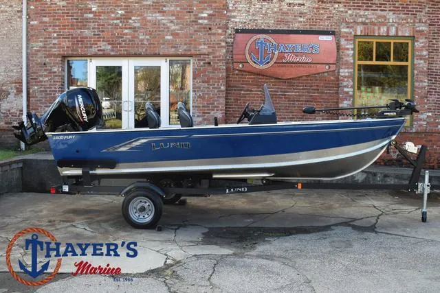 Slide: The Image of 2024 Lund 1600 Fury SS boat displayed at Thayer's Marine dealership. - 30