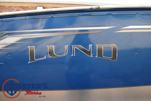 Slide: The Image of 2024 Lund 1600 Fury SS boat with blue exterior and logo detail. - 4