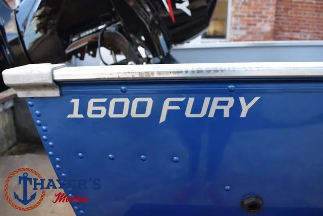 Slide: The Image of 2024 Lund 1600 Fury SS boat, blue exterior with branding. - 5