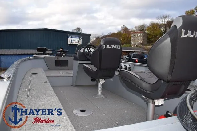 Slide: The Image of 2024 Lund 1600 Fury SS boat interior at Thayer's Marine dealership. - 11