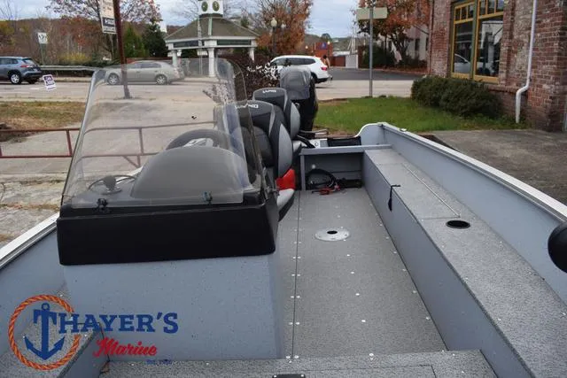 Slide: The Image of 2024 Lund 1600 Fury SS boat interior at Thayer's Marine dealership. - 14
