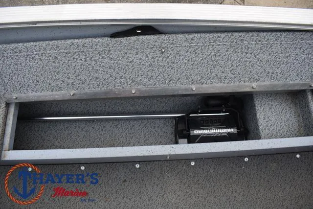 Slide: The Image of 2024 Lund 1600 Fury SS boat interior with storage compartment and Humminbird equipment. - 19