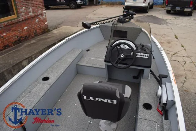 Slide: The Image of 2024 Lund 1600 Fury SS fishing boat interior with steering console and seating. - 21