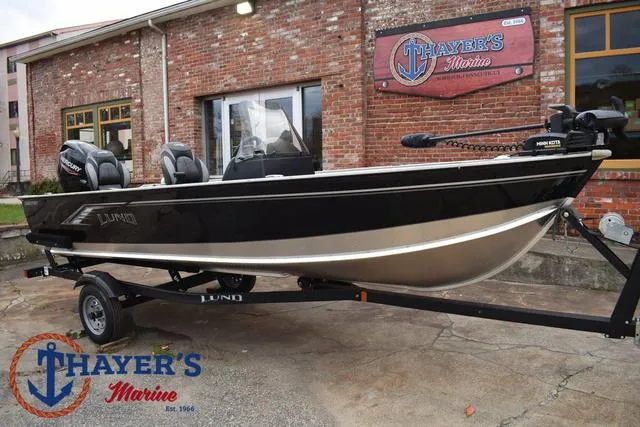 Slide: The Image of 2024 Lund 1600 Fury SS boat on trailer at Thayer's Marine dealership. - 23
