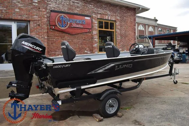 Slide: The Image of 2024 Lund 1600 Fury SS boat on trailer at Thayer's Marine dealership. - 24