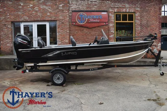 Slide: The Image of 2024 Lund 1600 Fury SS boat on trailer at Thayer's Marine. - 25